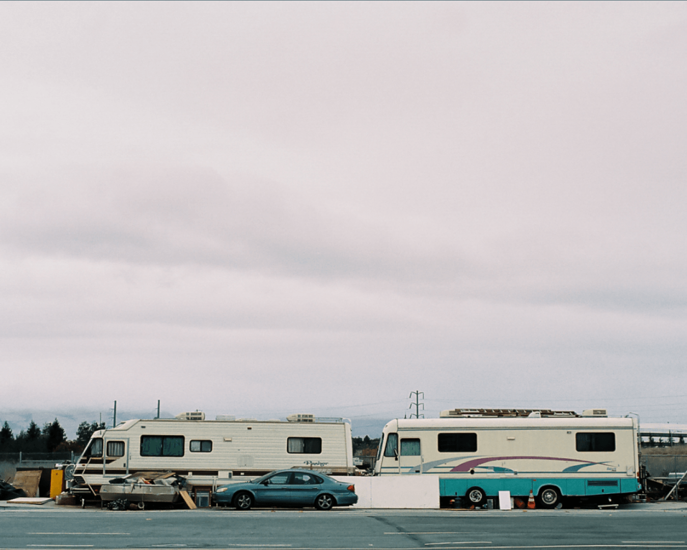 two rv's parked on the side of the road