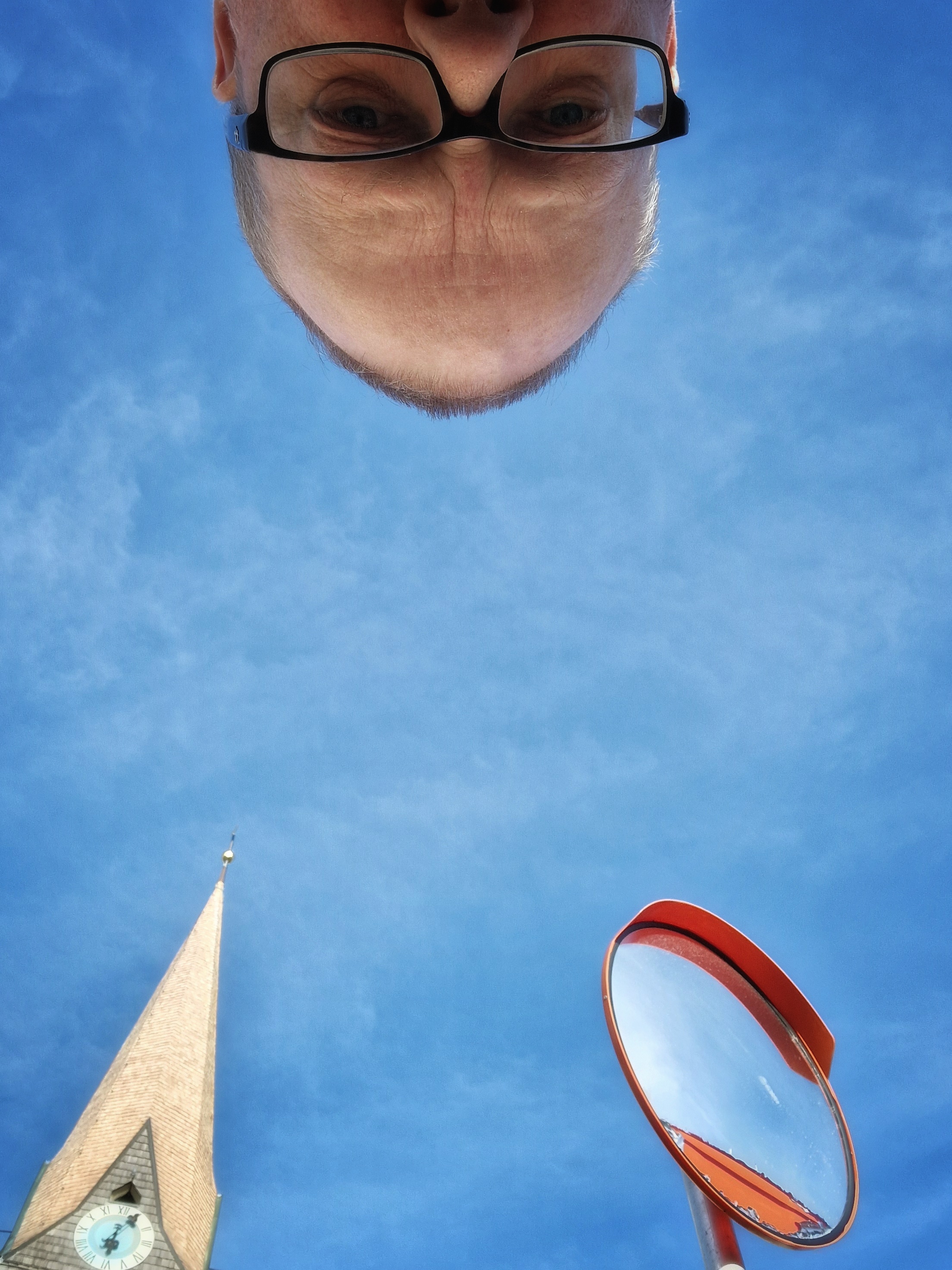 Head up, church-tower and mirror