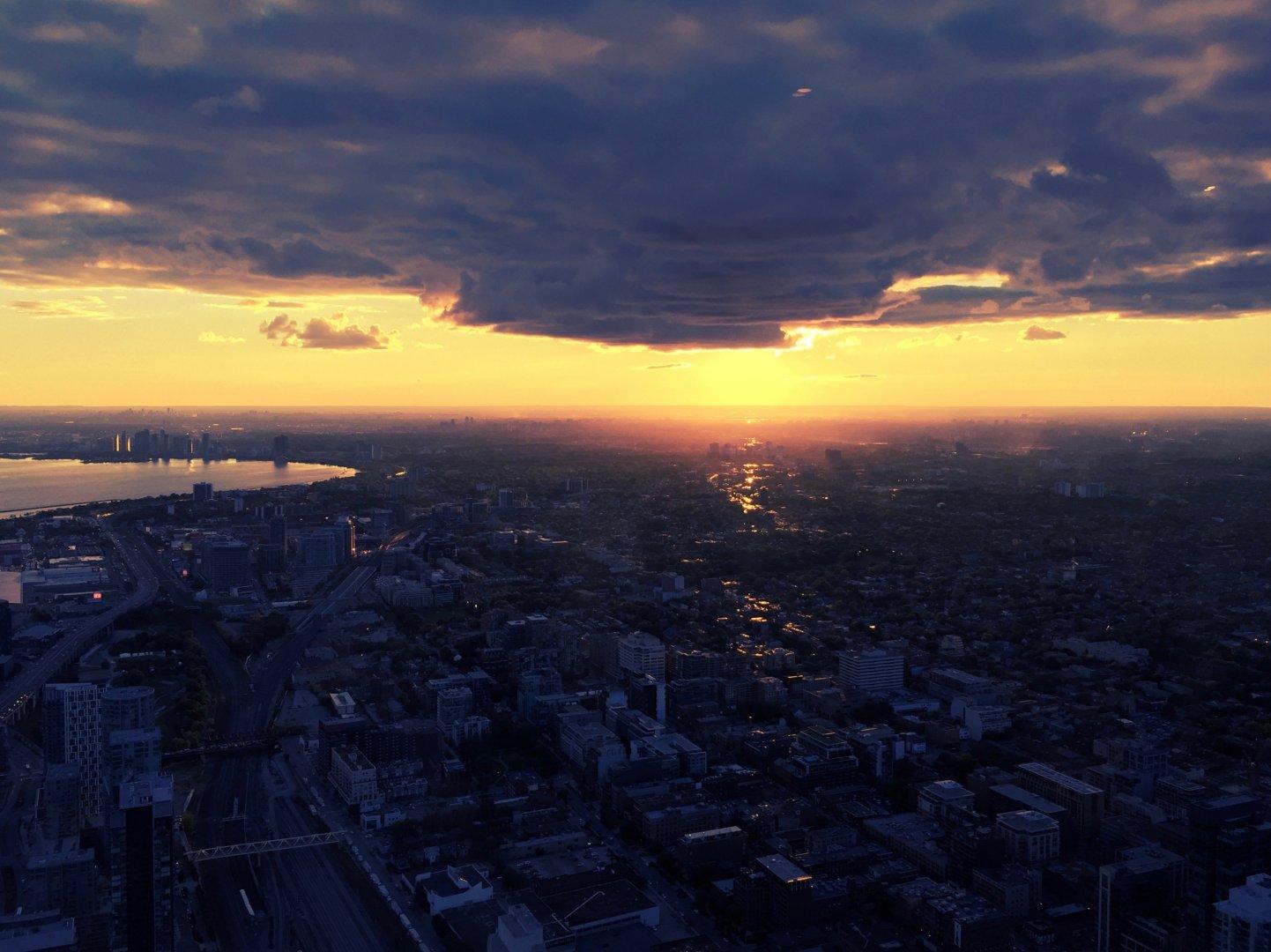 View from Toronto's CN Tower into the sunset over the city.